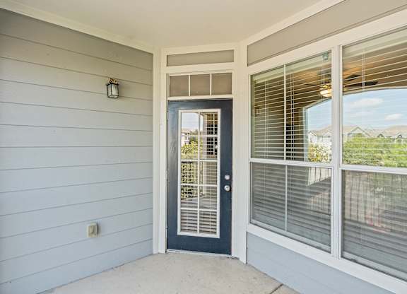 A white door with a window above it.