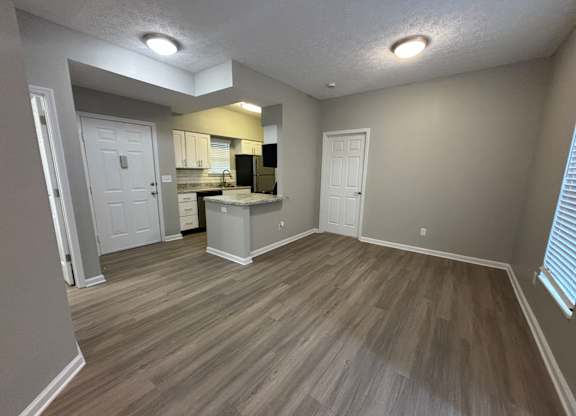 Fenwick Place Apartments in Louisville, KY 40220 - Living room looking into kitchen 2