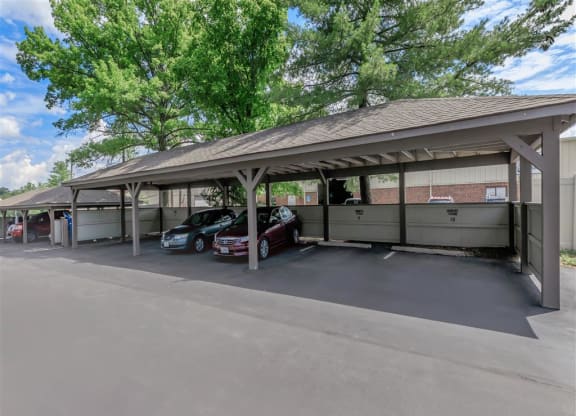 a parking garage with two cars parked in it