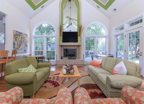 a living room with couches and a fireplace