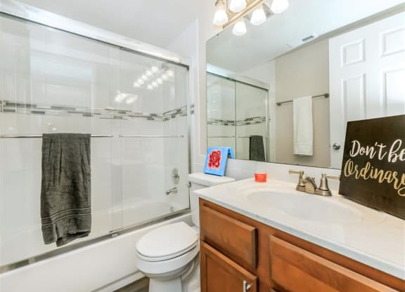 a bathroom with a sink toilet and a shower