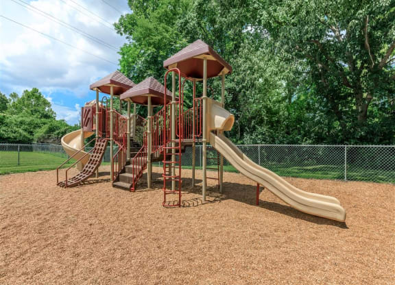 a playground with slides at a park