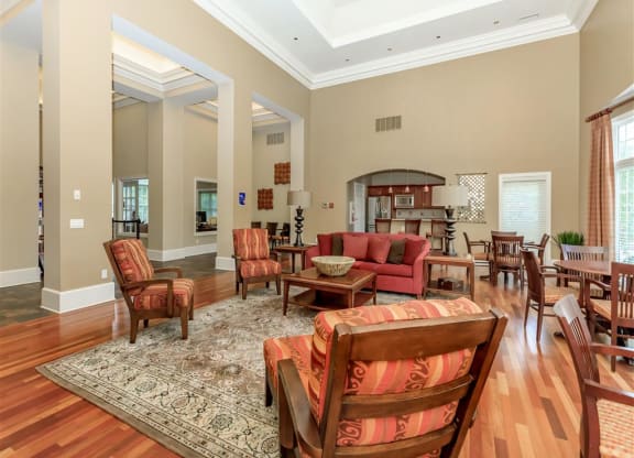 a large living room with furniture and a dining room