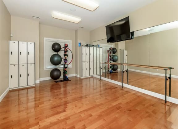 the locker room is equipped with lockers and a tv