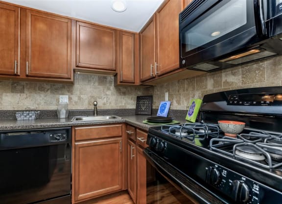 a kitchen with a stove and a microwave