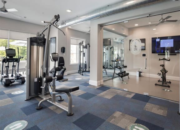 a gym with weights and other equipment in a building