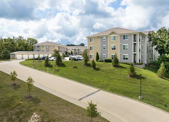 A large building with a parking lot in front of it.