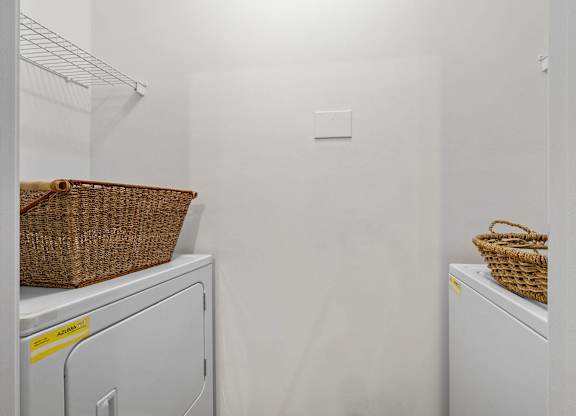 A laundry room with a washer and dryer.