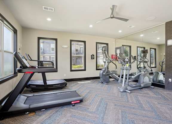 Fitness center with treadmills and elliptical machines at Highline Urban Lofts Apartments, Cypress, 77429