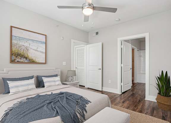Bedroom with wood flooring and ceiling fan at Highline Urban Lofts Apartments, Cypress