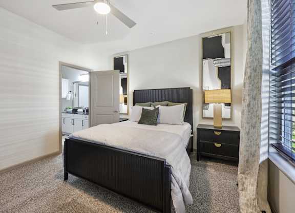 bedroom with ceiling fan at Vine + Vail Townhomes and Apartments, Grapevine, TX 76051