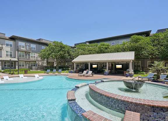 Resort style pool with sun shelf and covered cabana at Highline Urban Lofts Apartments, Texas, 77429