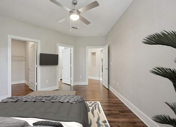 Spacious bedroom with vaulted ceiling and multiple doorways at Highline Urban Lofts Apartments, Cypress