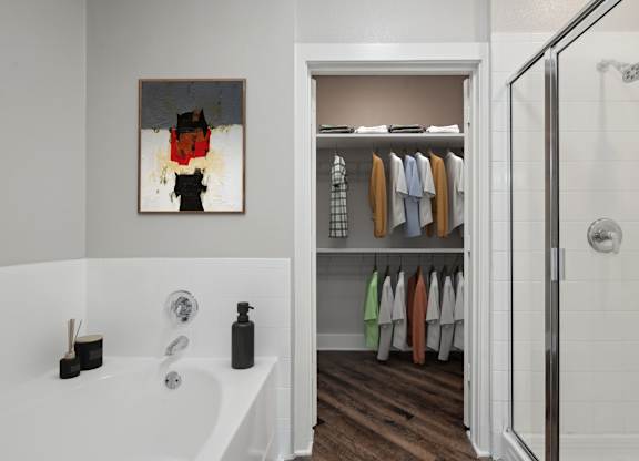 Bathroom with soaking tub and walk-in closet at Highline Urban Lofts Apartments, Cypress