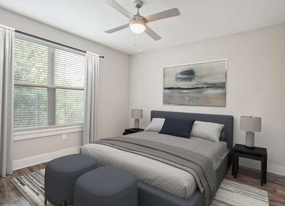 Bedroom with ceiling fan and upholstered bed frame at Highline Urban Lofts Apartments, Cypress