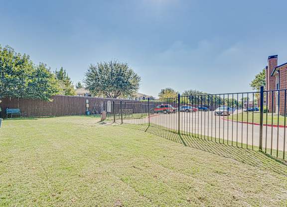Backyard with a fence at Bardin Oaks Apartments, Arlington, TX, 76018