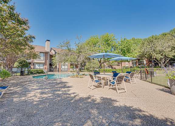 Backyard with a pool at Bardin Oaks Apartments, Arlington, 76018