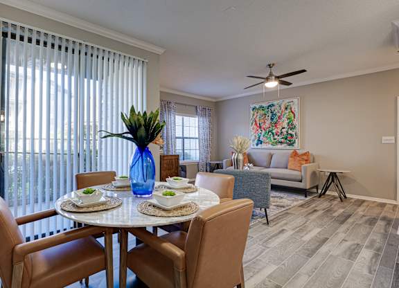 Open concept dining and living room at Carmel Creekside Apartments, Texas