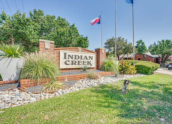 the sign creek at the entrance to the subdivision at Indian Creek Apartments, Texas
