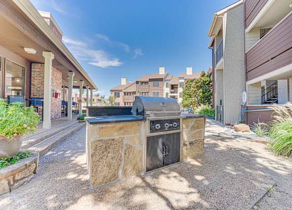 stone fireplace with surrounded building at Timberglen Apartments, Dallas, 75287