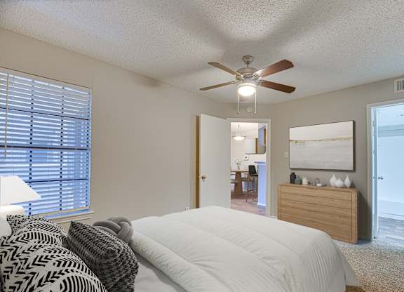 bedroom with a large bed at Timberglen Apartments, Dallas, 75287