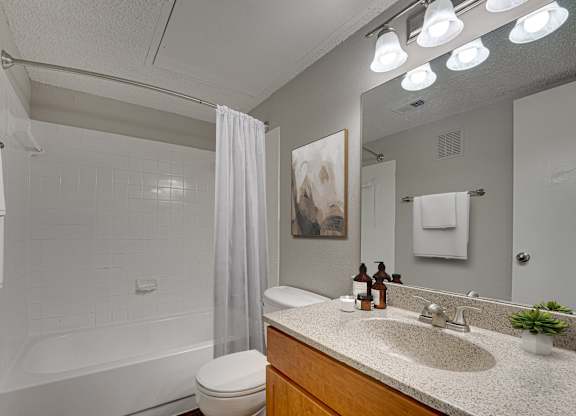 bathroom with white bathtub at Timberglen Apartments, Dallas, TX 75287