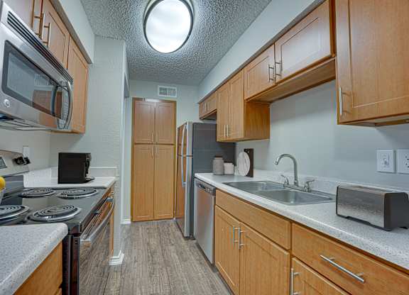 Kitchen with microwave at top of stove at Timberglen Apartments, Dallas, 75287