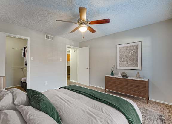 Bedroom with wall painting at Timberglen Apartments, Texas