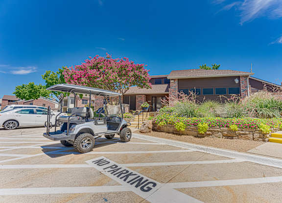 golf cart is parked in a no parking zone at Timberglen Apartments, Dallas, TX