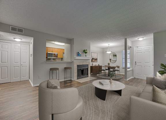 Grey couches in living room at Timberglen Apartments, Dallas, TX 75287