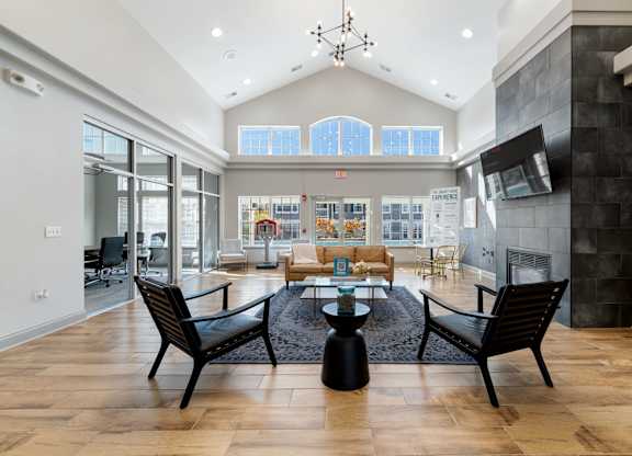 A modern living room with a fireplace and a dining table.