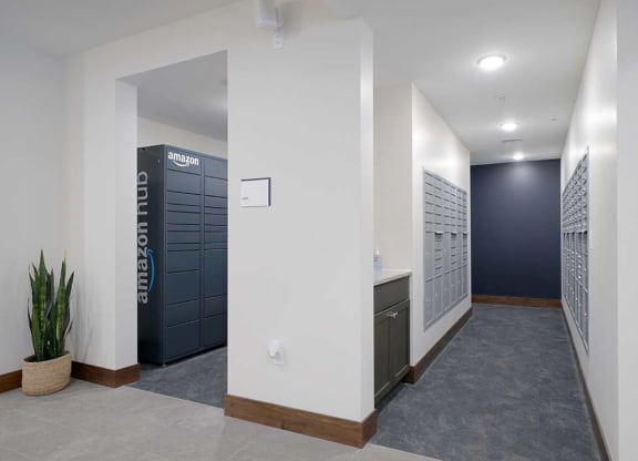 a mail room with mailboxes and amazon lockers