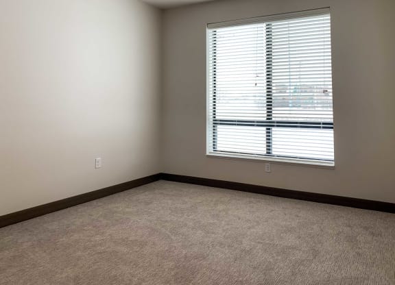 a bedroom with a large window