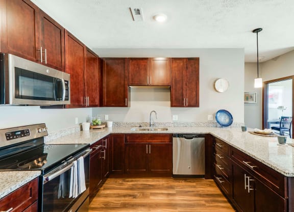 Spacious kitchen with granite countertops of 2 bedroom apartment for rent at 360 at Jordan West best new apartments West Des Moines IA 50266