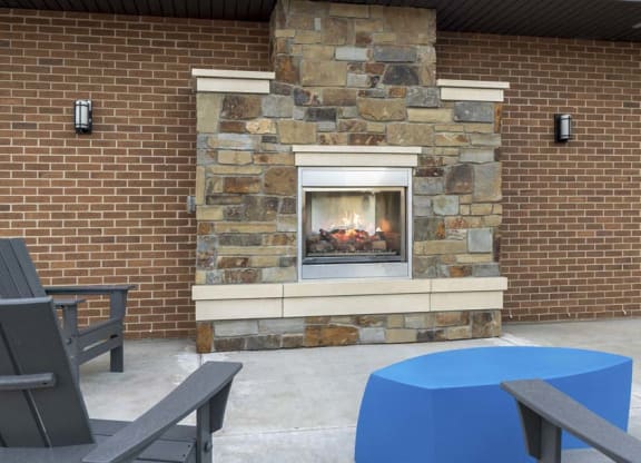 Outdoor fireplace and social lounge at 360 at Jordan West best new apartments West Des Moines IA 50266