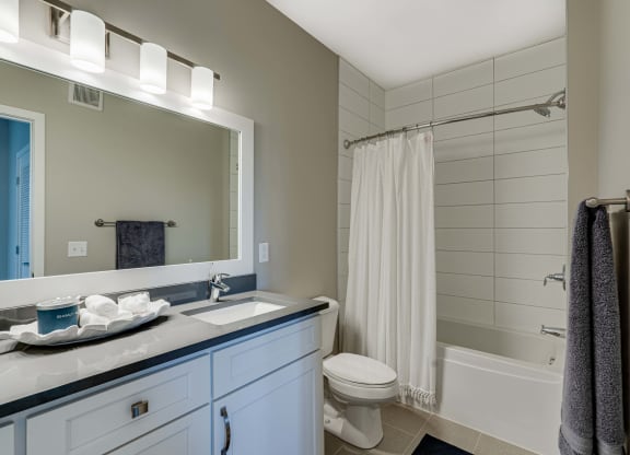 Large bathroom with tiled tub and shower surround in 2 bedroom Princeton floor plan