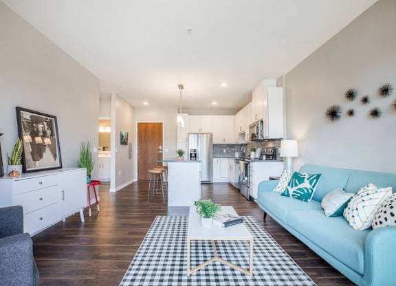 Open floor plan with hardwood floors and white cabinetry at Ascend at Woodbury MN 55129 new luxury apartments