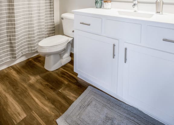 Bathroom with white cabinetry at Ascend at Woodbury new luxury apartments in Woodbury MN 55129