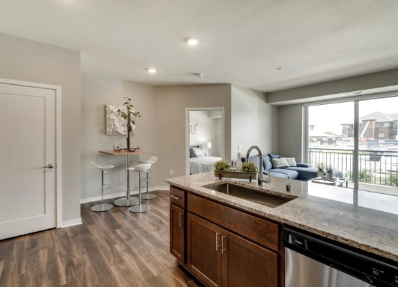 Cherry design scheme with darker cabinetry at Ascend at Woodbury new luxury apartments in Woodbury MN 55129