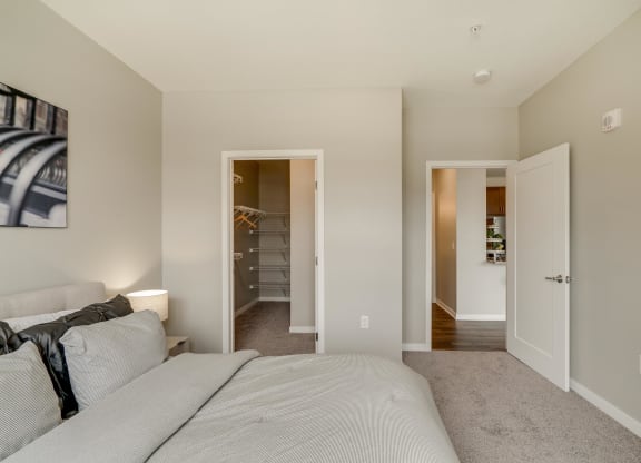 Bedroom with walk-in closet at Ascend at Woodbury in Woodbury MN
