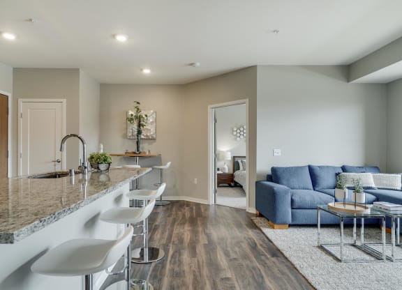 Open floor plan with kitchen, dining and living room at Ascend at Woodbury MN 55129 new luxury apartments