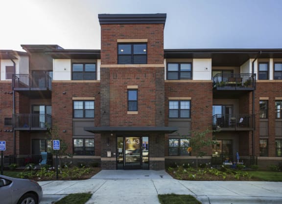 Exterior building view with controlled access entry at Ascend at Woodbury MN 55129 new luxury apartments