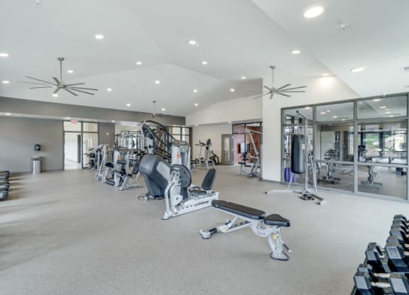 Large fitness center with free weights, weightlifting machines and cardio equipment at Ascend at Woodbury in MN