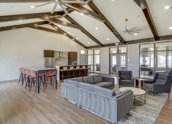 Clubhouse with seating and deluxe kitchen for entertaining at Ascend at Woodbury new luxury apartments in Woodbury MN 55129