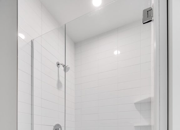 Large shower with glass door at Aspire at CityPlace in Woodbury, Minnesota