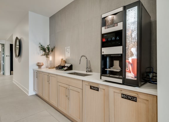 Community coffee bar with automated coffee machine in the lobby at Aspire at CityPlace