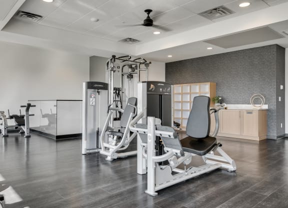Fitness center with strength training machines at luxury apartments in Woodbury