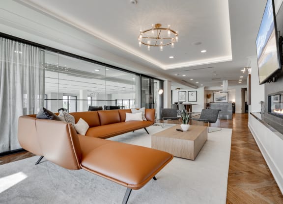 Sitting area with full wall windows in upper level of the lobby at Aspire at CityPlace
