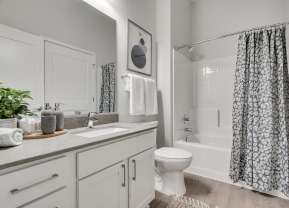 Bathroom with light counters and cabinets at luxury apartments in Woodbury MN 55125
