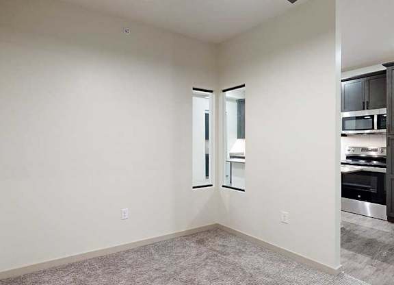a sleeping area with a privacy wall with a small window